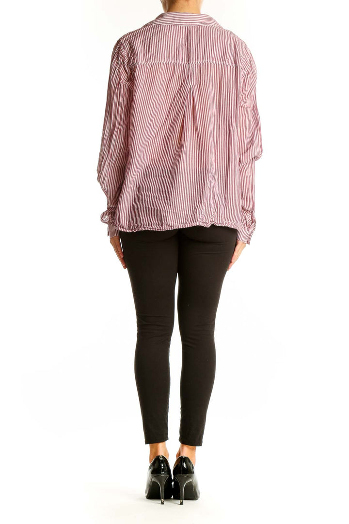 Back view of red and white striped button-down shirt by cloth & stone