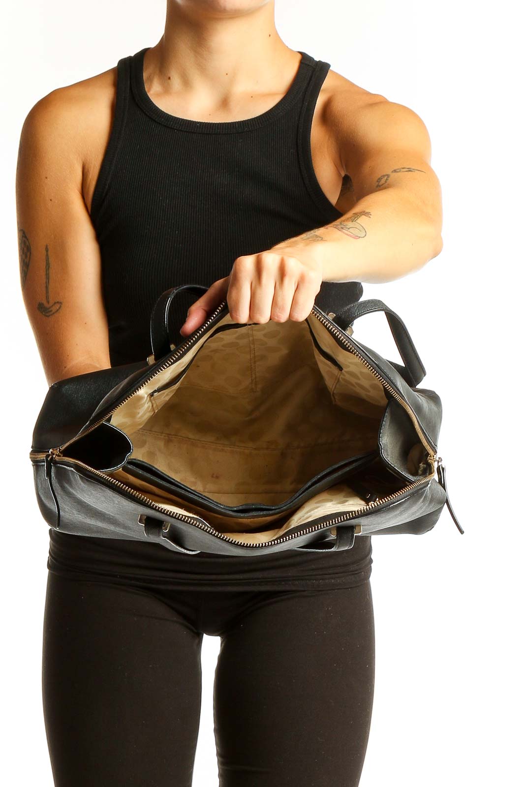 Kate Spade black leather shoulder bag worn by model