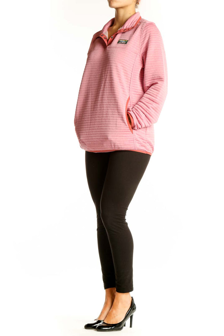 Front view of pink striped L.L.Bean polyester pullover with quarter-zip collar