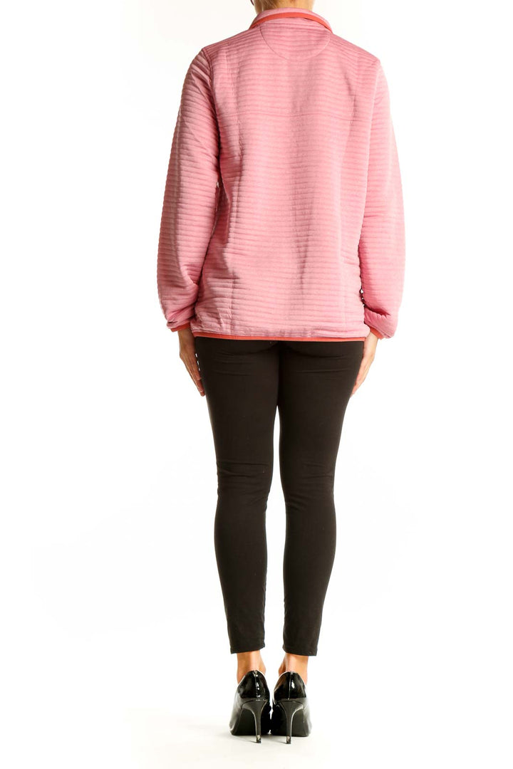 Side view of model wearing pink striped L.L.Bean polyester pullover