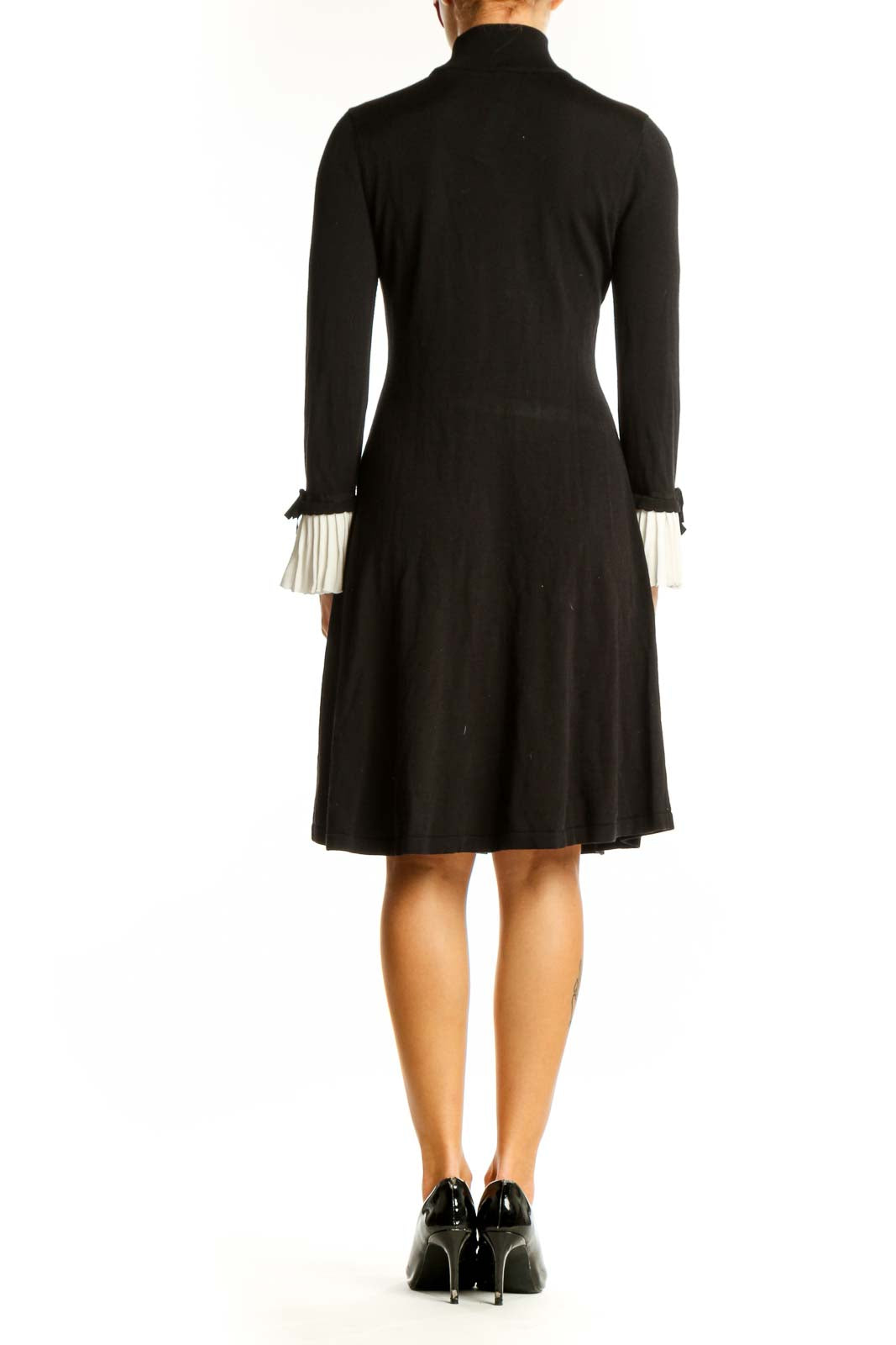 Back view of CeCe black flared dress showing full-length silhouette