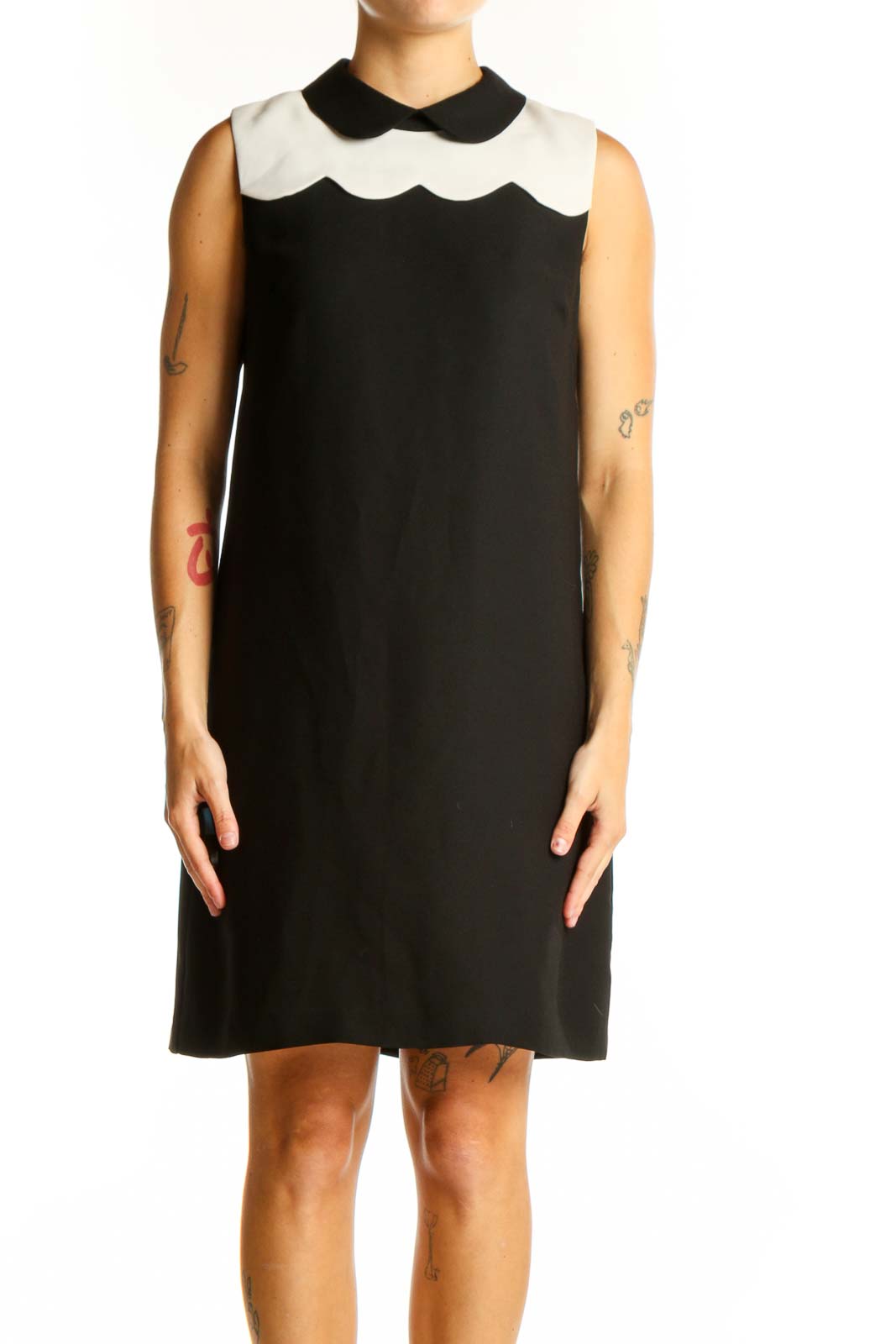 Front view of CeCe black sleeveless dress with white scalloped collar