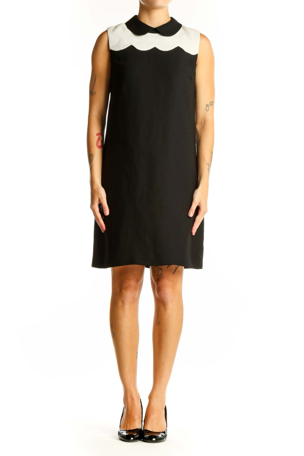 Front view of CeCe black sleeveless dress with white scalloped collar