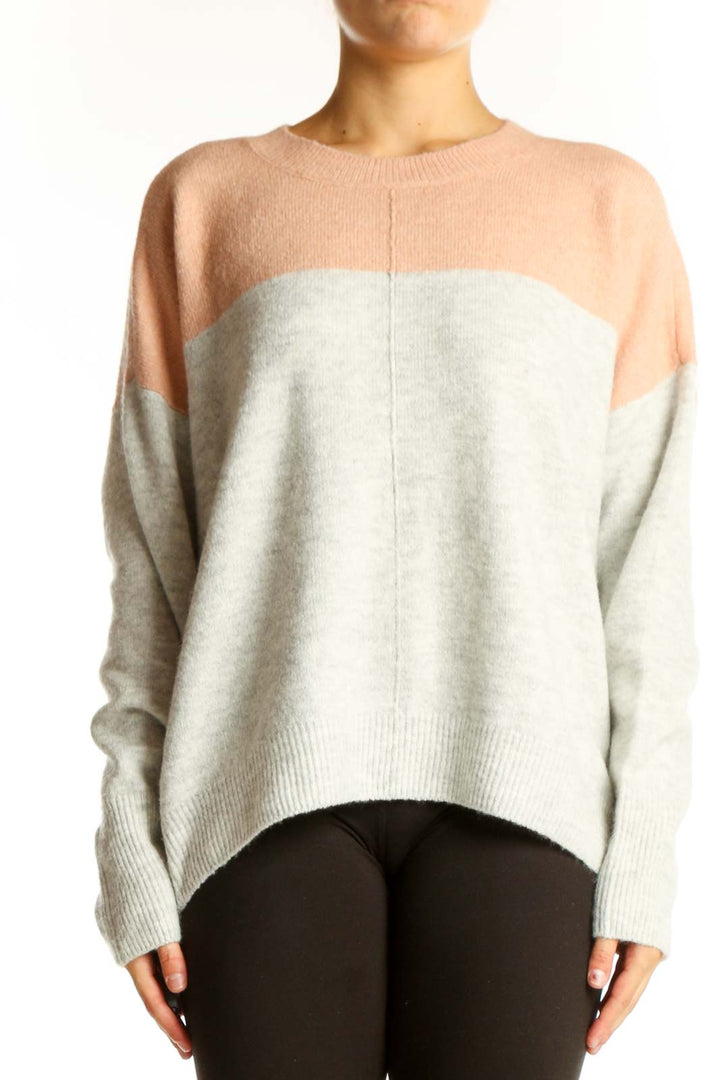 Front view of Vince Camuto peach and gray color block knit sweater