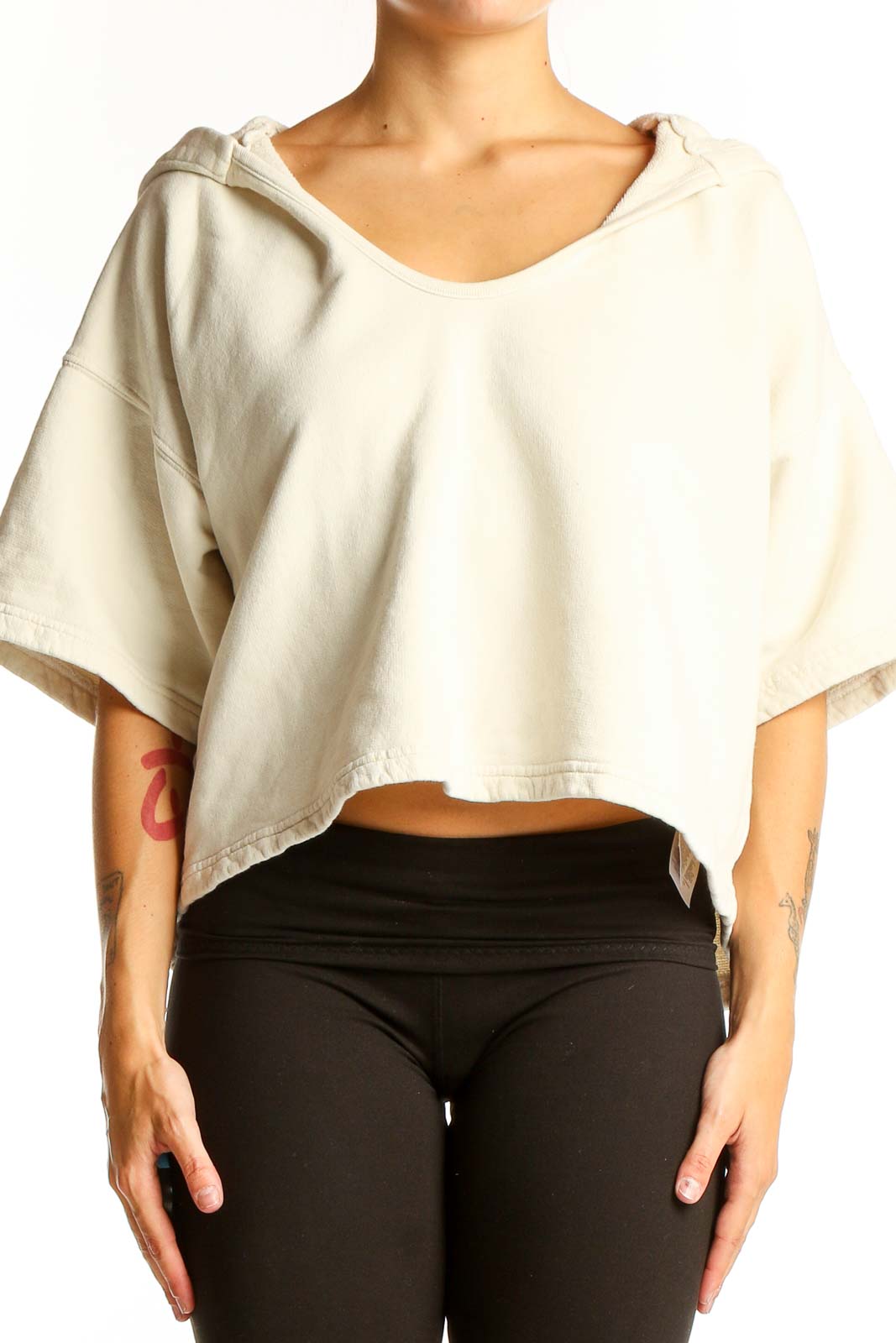 Front view of Joie cream cropped hooded cotton top with wide sleeves
