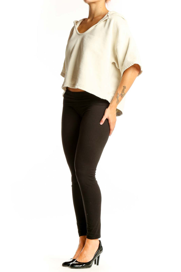 Front view of Joie cream cropped hooded cotton top with wide sleeves