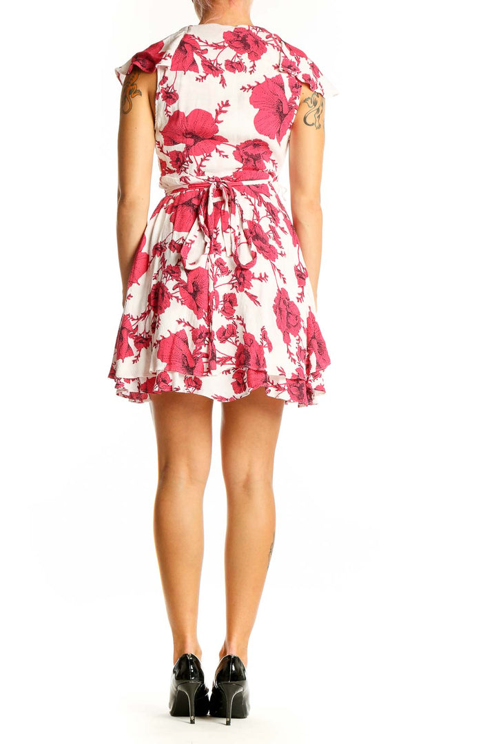 Side view of red floral wrap mini dress showing A-line silhouette