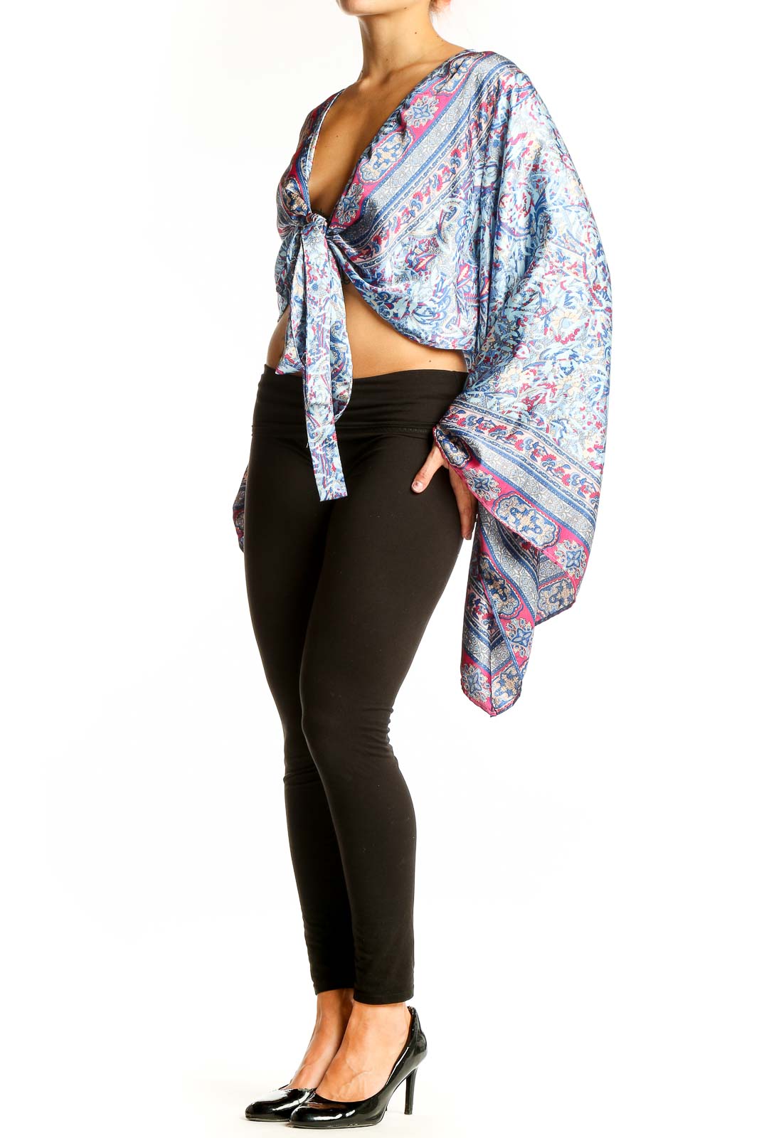 Front view of Galita Blue Floral Paisley Tie-Front Crop Top with long bell sleeves