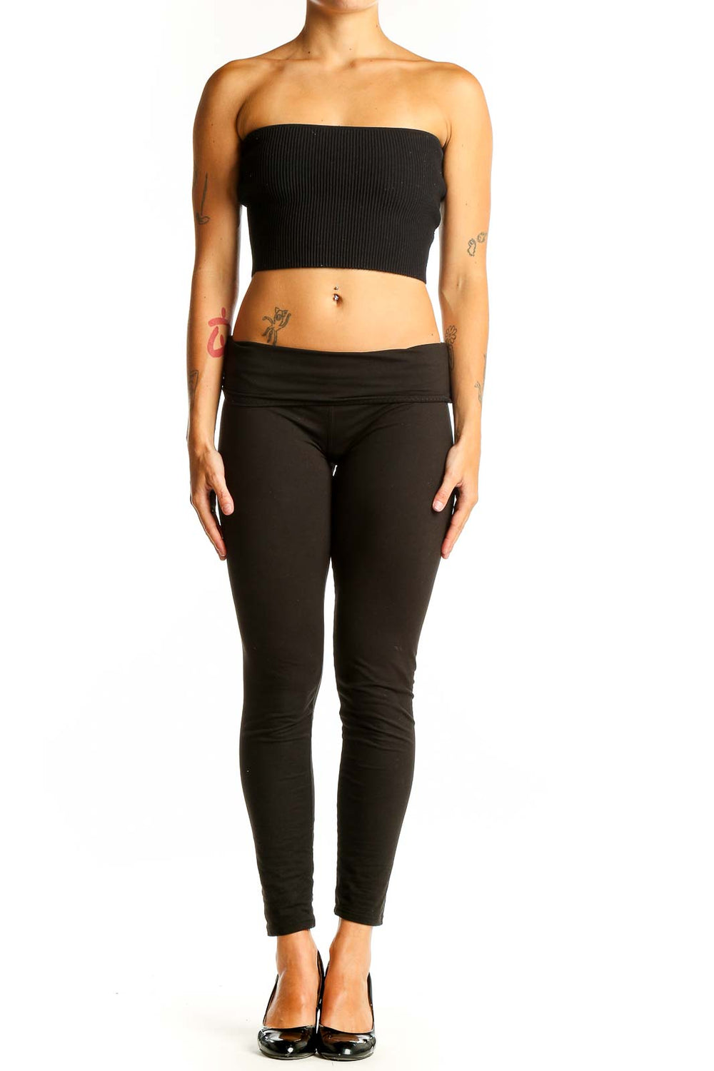 Front view of black ribbed strapless crop top on model