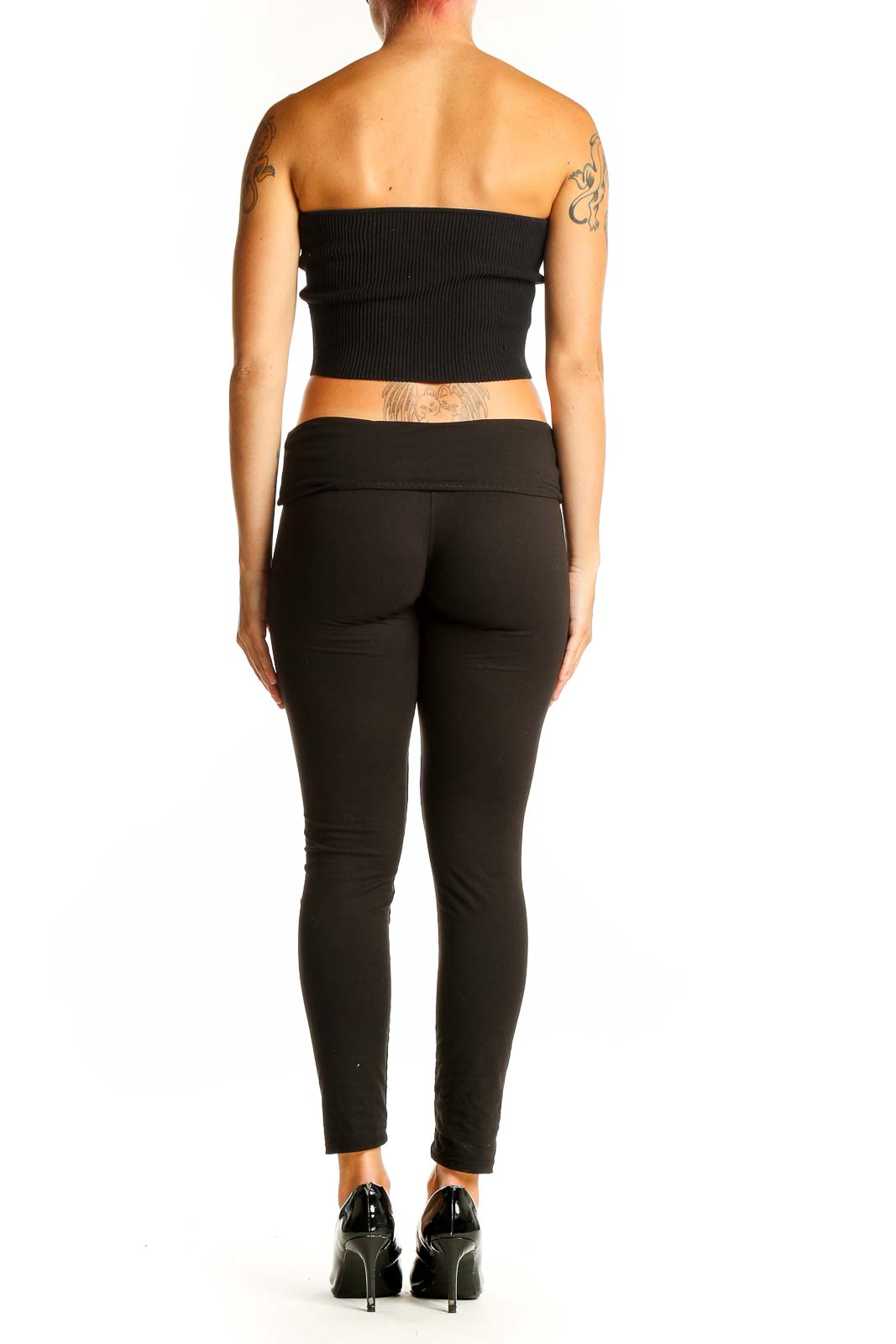 Side view of black ribbed strapless crop top with matching pants