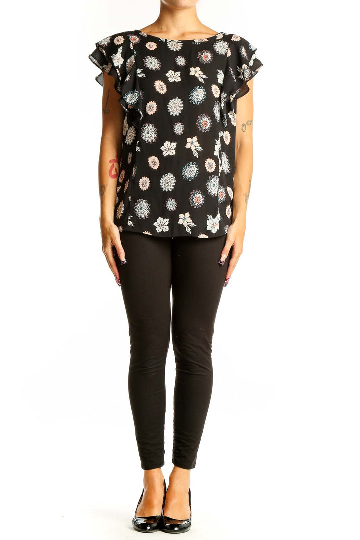 Front view of LOFT Outlet black floral print top with ruffle sleeves