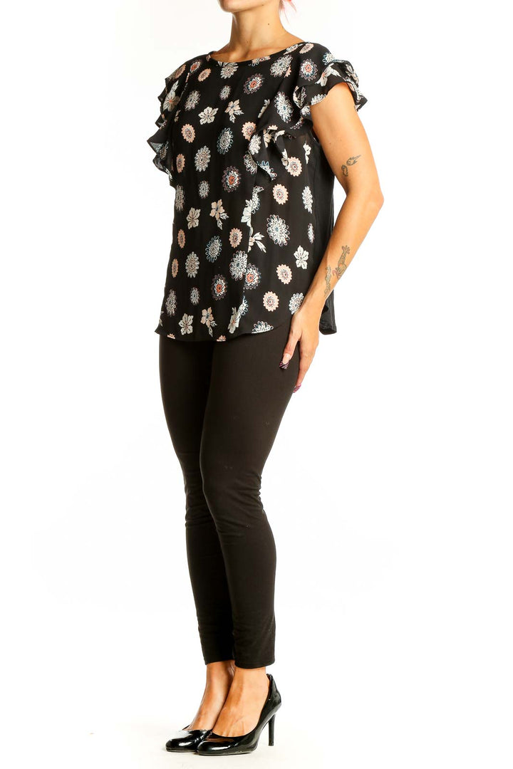Front view of LOFT Outlet black floral print top with ruffle sleeves