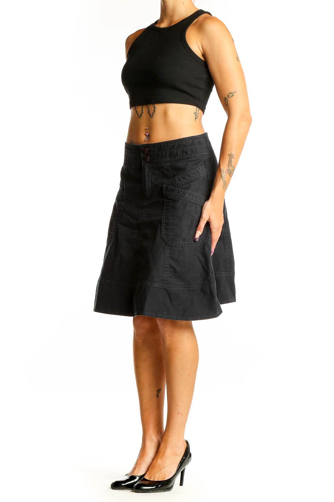 Front view of Nanette Lepore black denim A-line skirt with front pockets