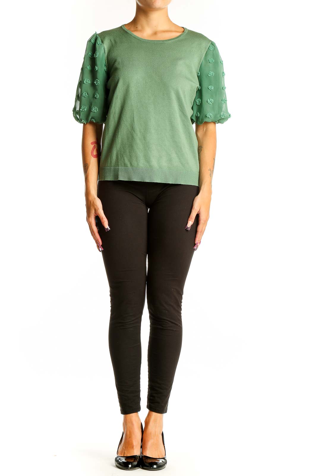 Front view of Adrianna Papell green knit top with floral appliqué puff sleeves