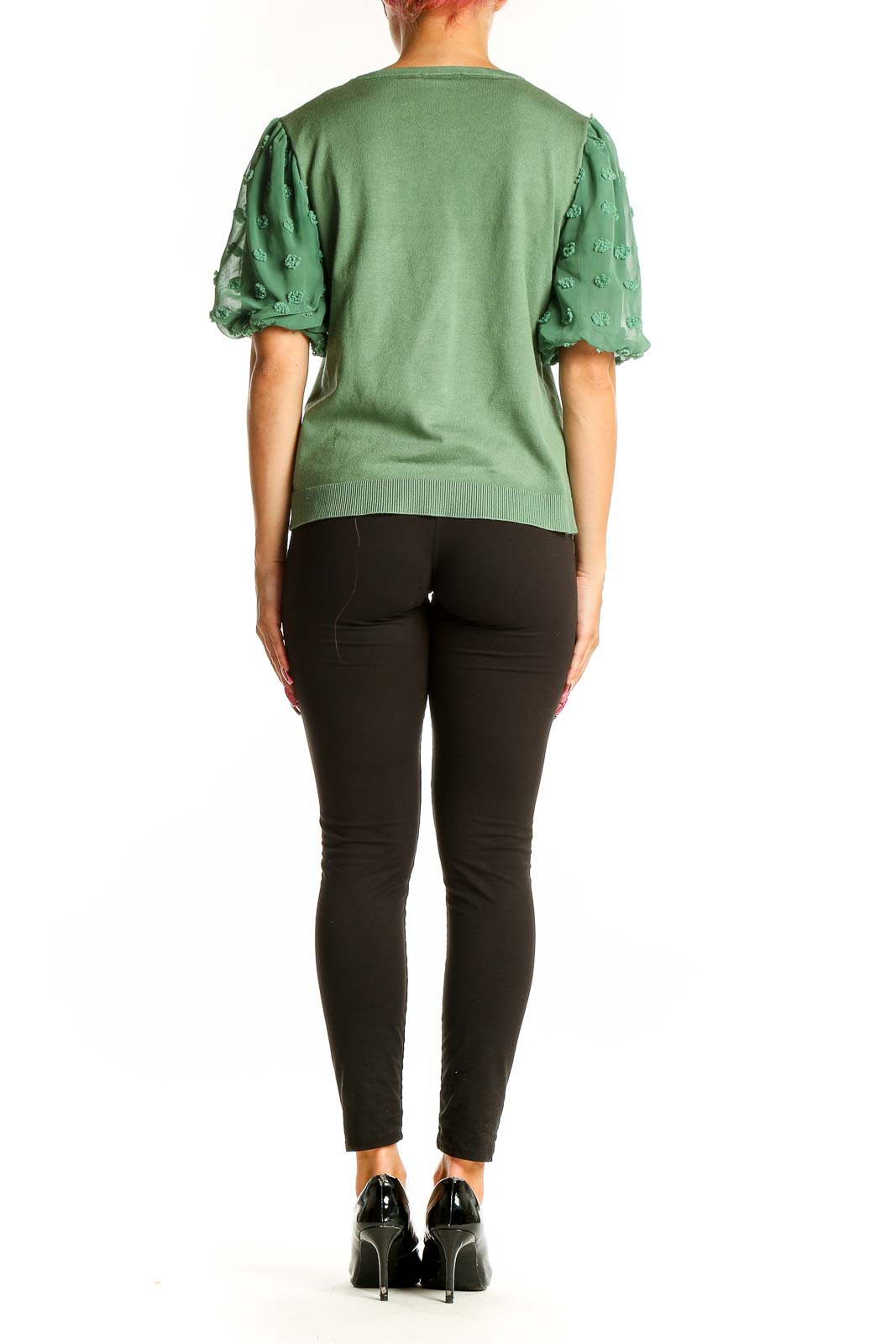 Side view of Adrianna Papell green knit top showing puff sleeve detail