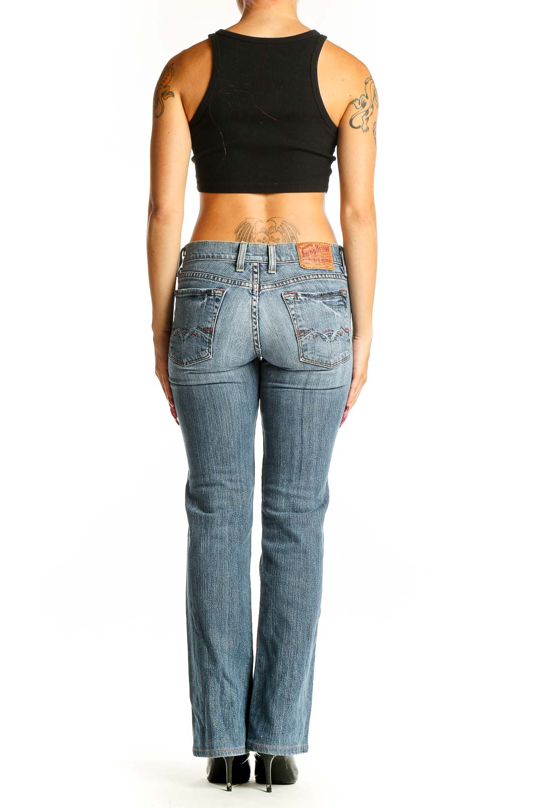 Back view of Lucky Brand blue denim bootcut jeans on model