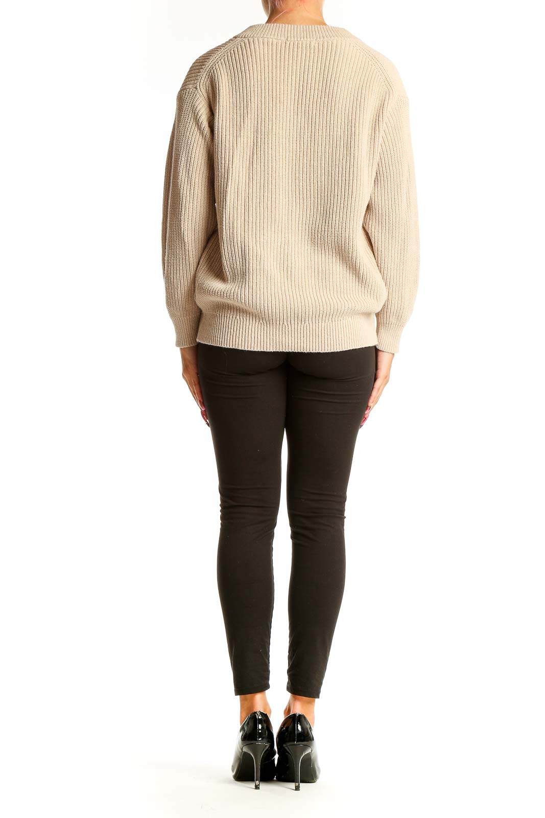 Side view of Uniqlo beige ribbed V-neck sweater on model with black pants
