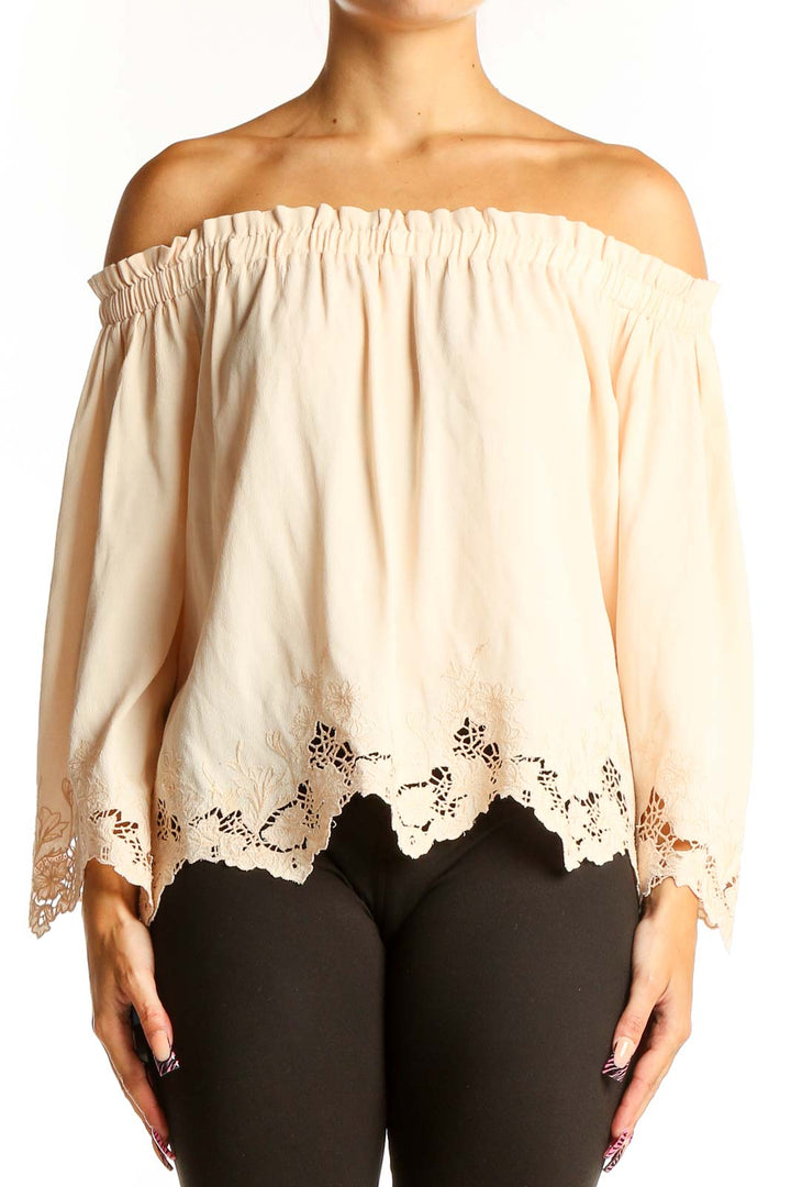 Front view of cream off-shoulder lace-trimmed blouse by ASTR