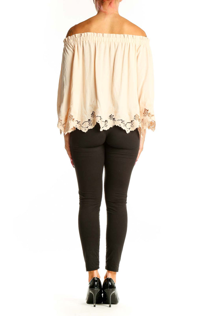 Back view of cream off-shoulder lace-trimmed blouse by ASTR