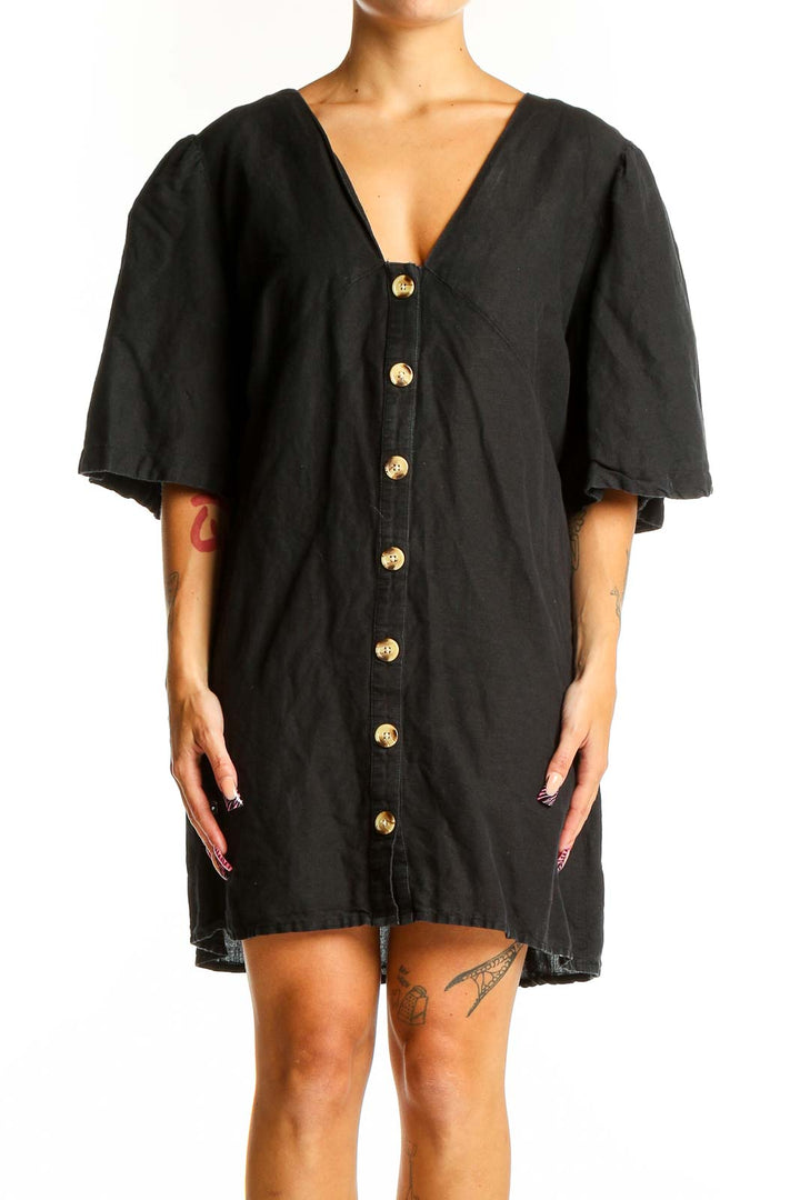 Front view of black Topshop mini dress with gold buttons and flutter sleeves