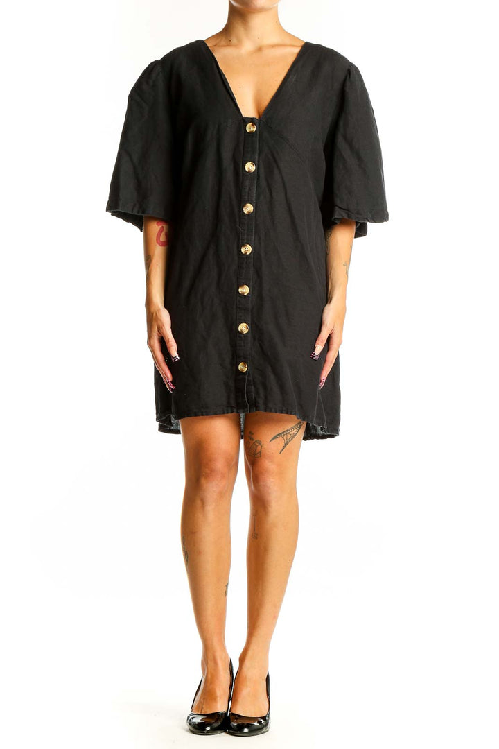 Front view of black Topshop mini dress with gold buttons and flutter sleeves