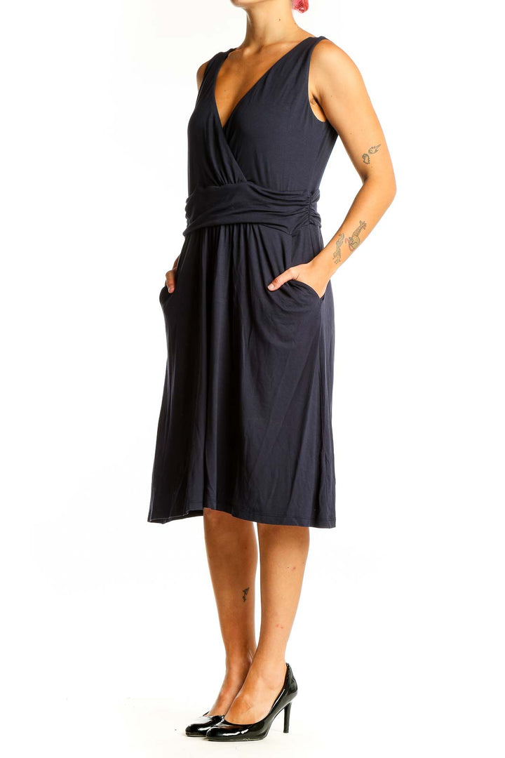 Front view of navy Boden wrap-style sleeveless midi dress