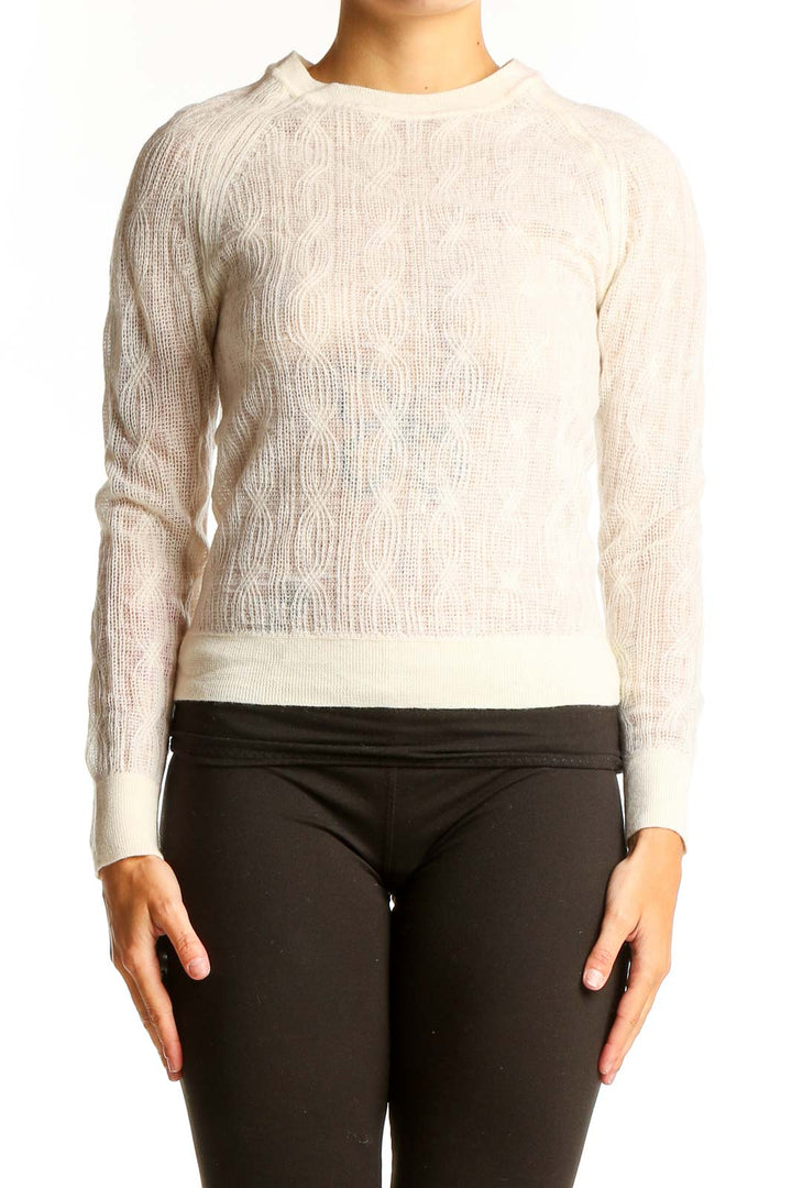 Front view of cream Merino wool cable knit sweater from Banana Republic