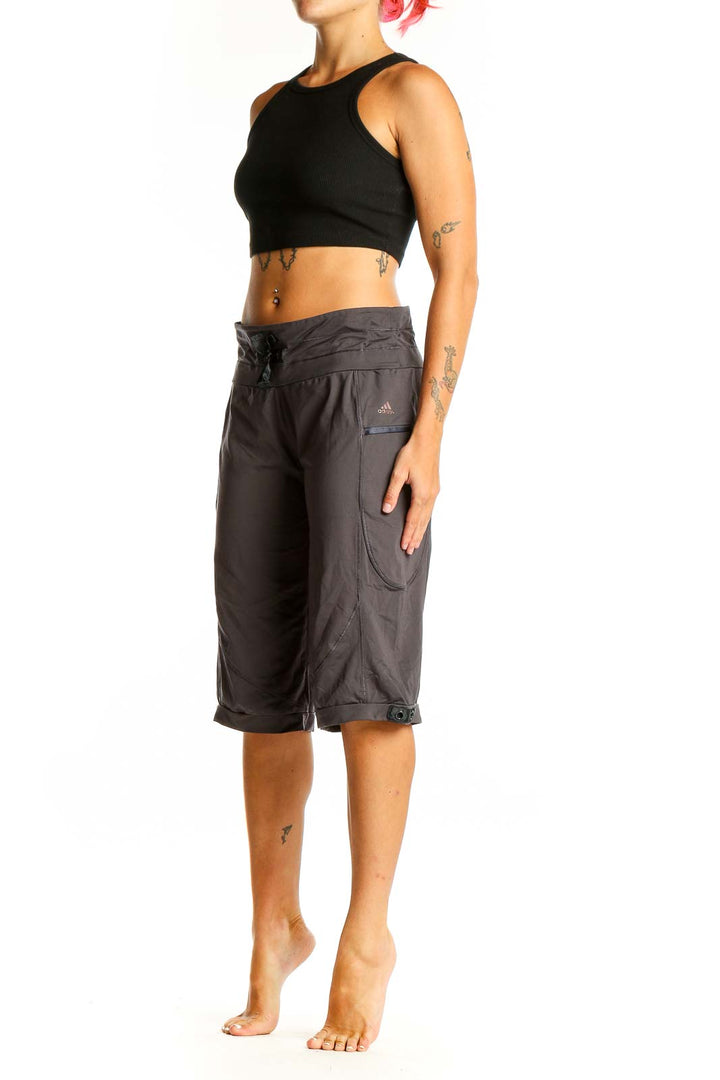 Front view of gray Adidas activewear capri pants with drawstring waist
