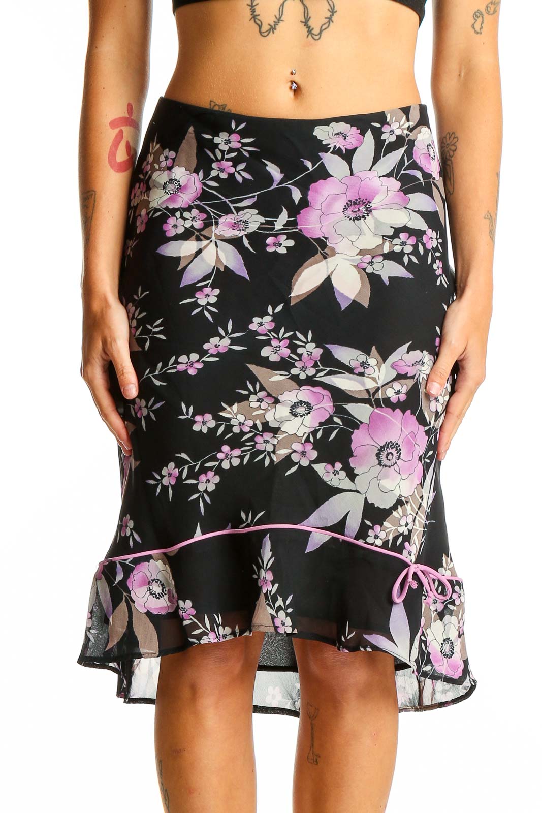 Front view of Lily black floral midi skirt with ruffled hem