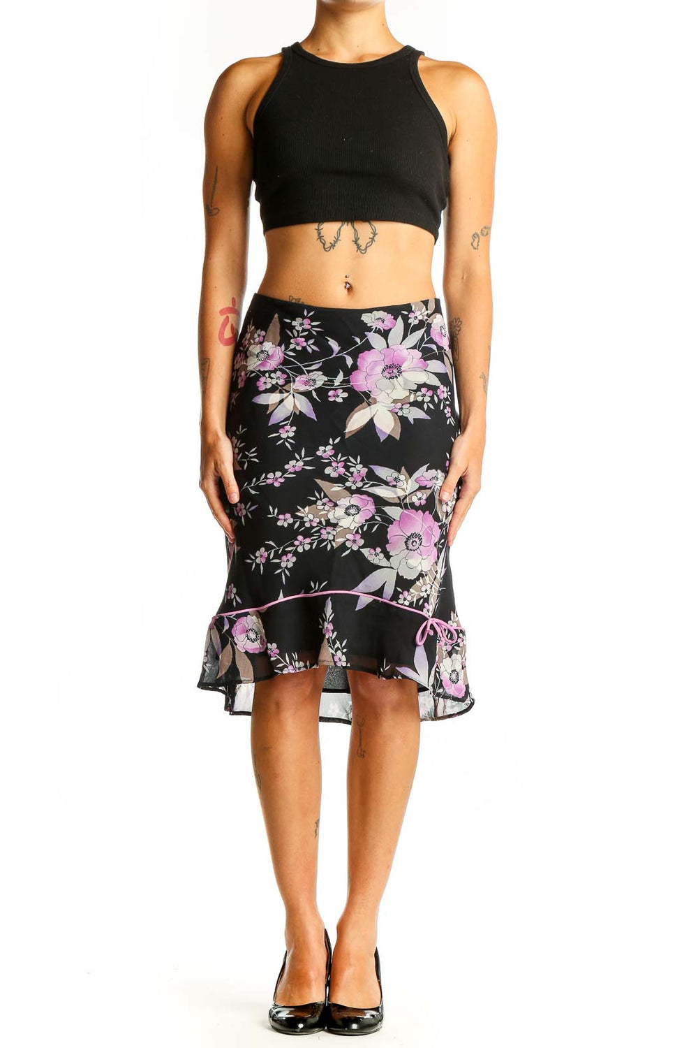 Front view of Lily black floral midi skirt with ruffled hem