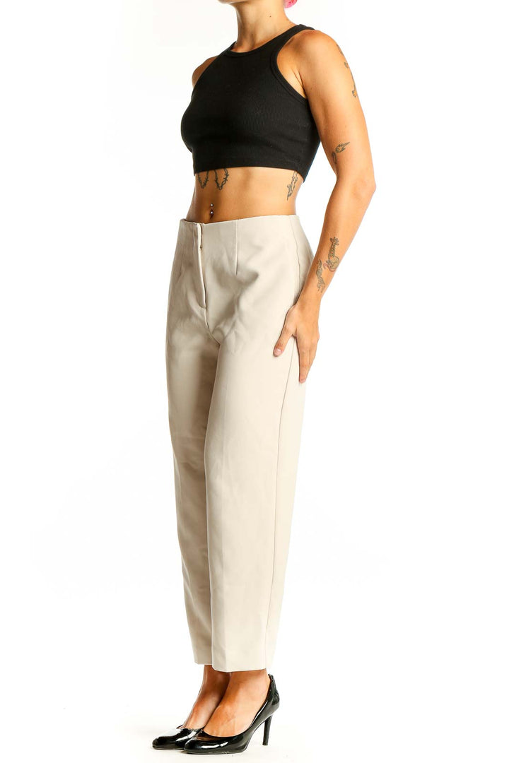 Front view of Ann Taylor beige tailored ankle-length trousers