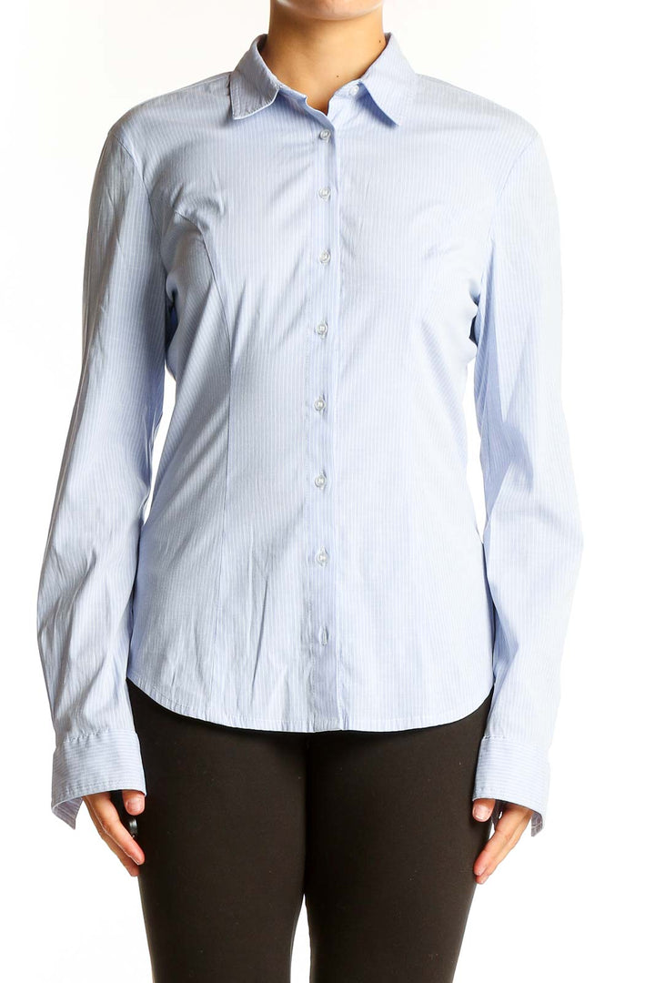 Front view of RESERVED light blue striped button-up shirt