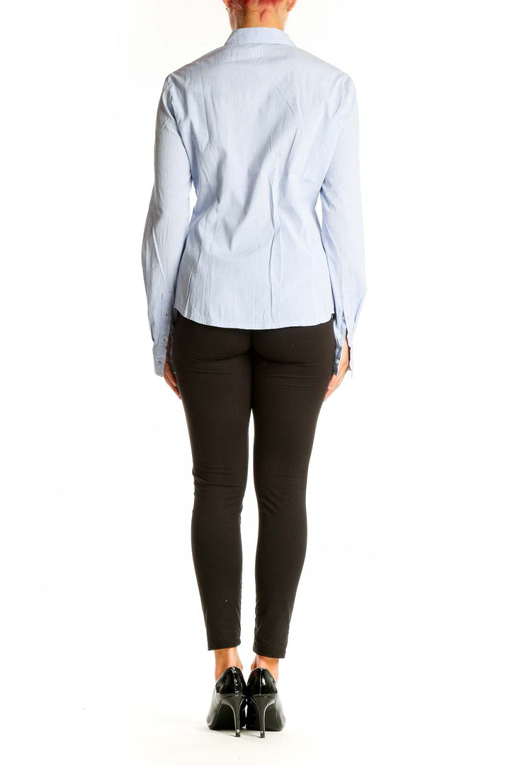 Back view of RESERVED light blue striped button-up shirt on model