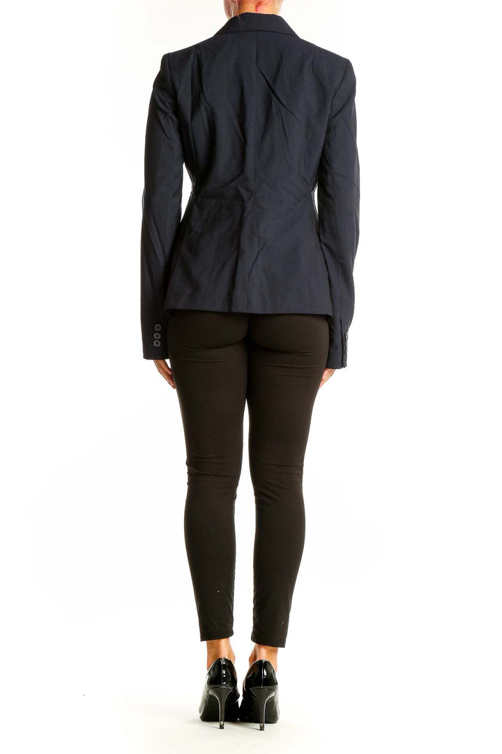 Back view of Banana Republic navy wool blend blazer on model with black pants
