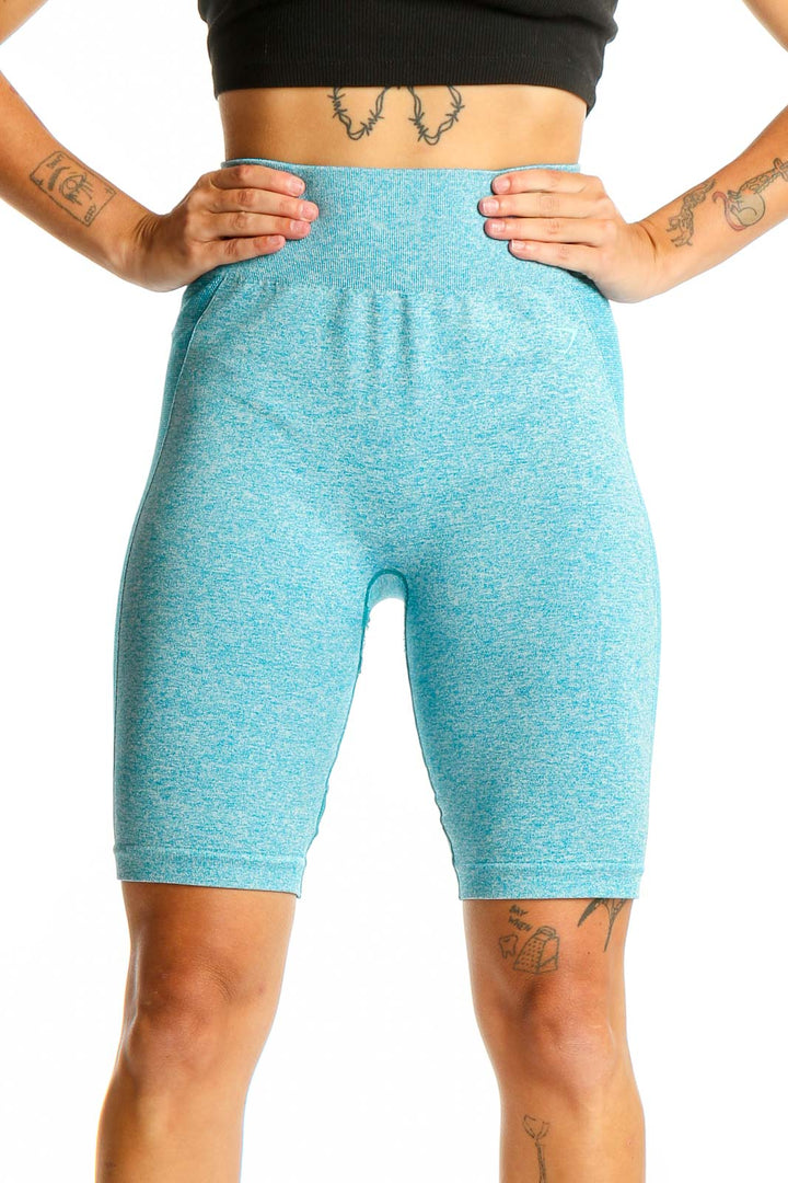 Front view of teal Gymshark high-waisted compression biker shorts