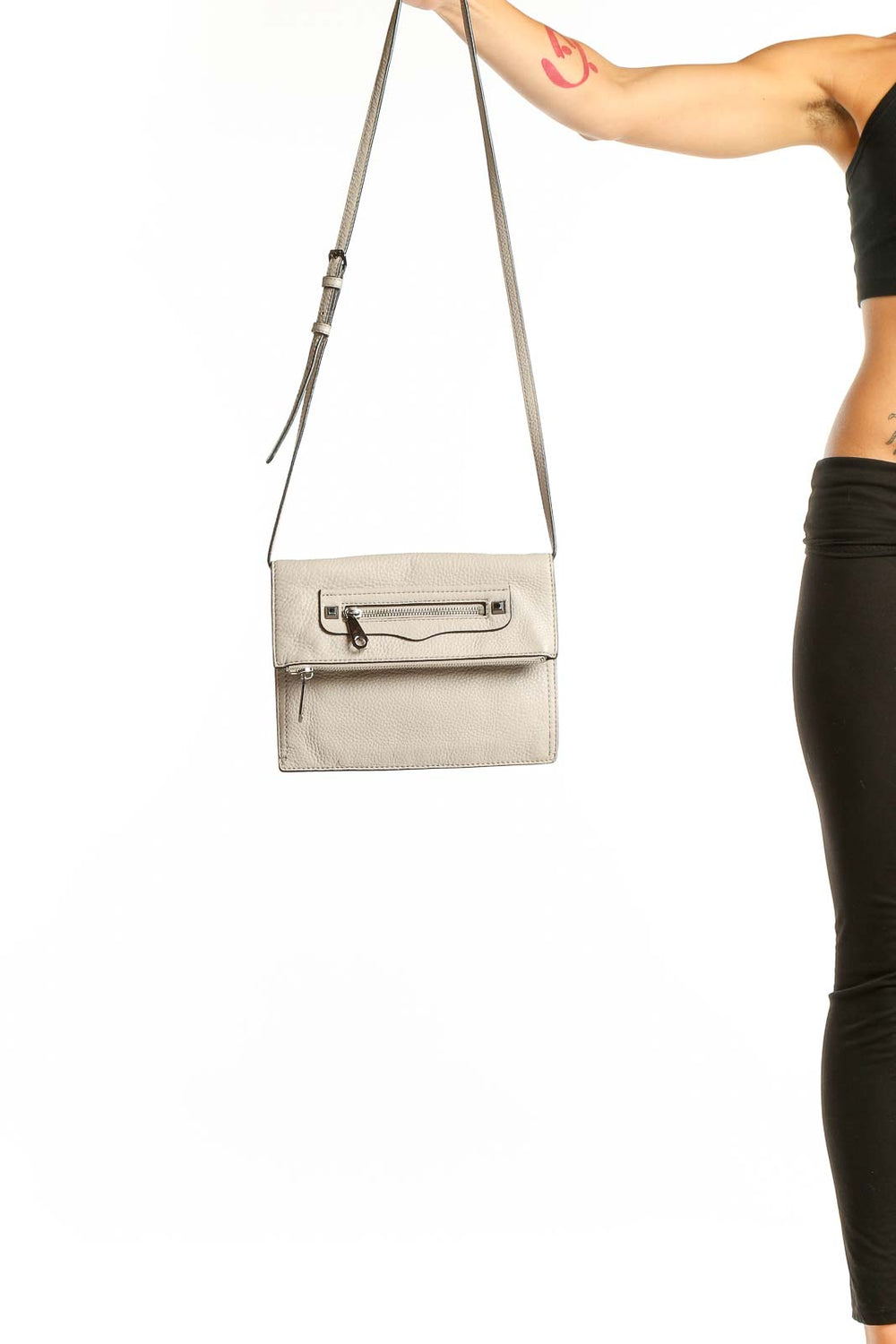 Front view of Rebecca Minkoff beige leather crossbody bag with silver hardware