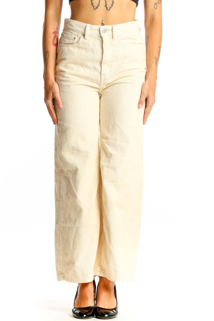 Front view of BDG cream corduroy wide-leg pants