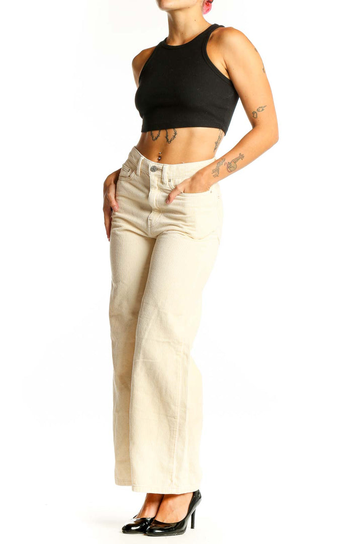 Front view of BDG cream corduroy wide-leg pants