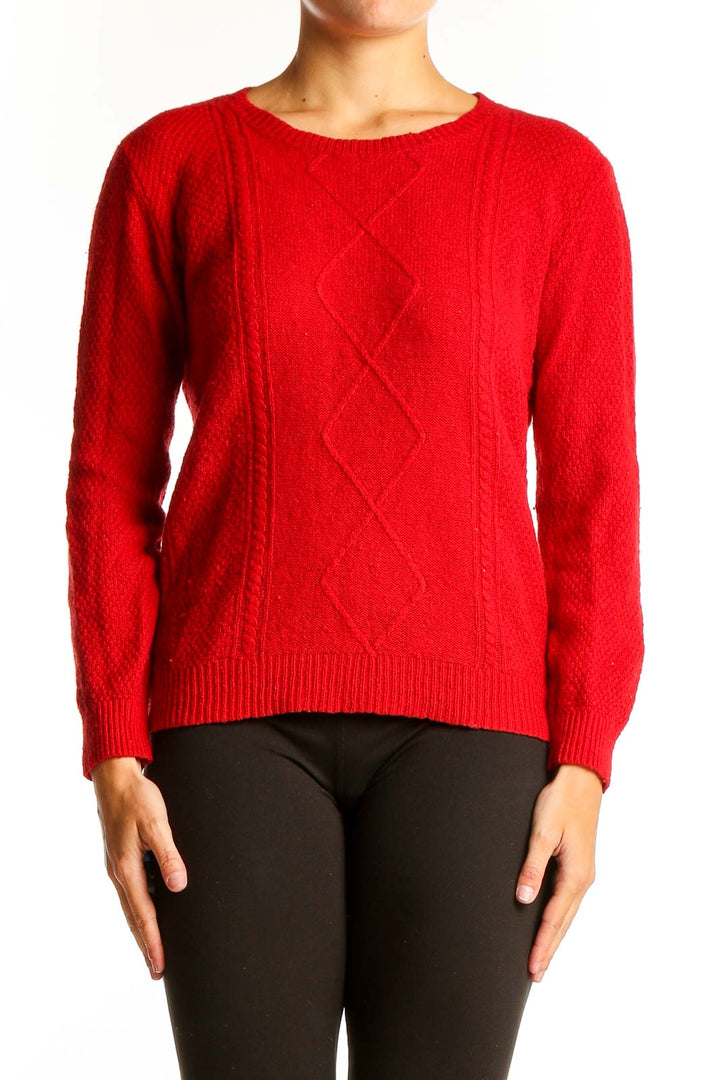 Front view of red cable knit crewneck sweater from Mango