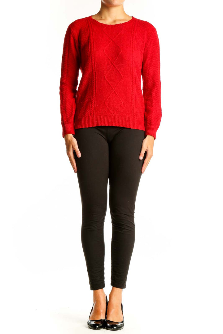 Front view of red cable knit crewneck sweater from Mango