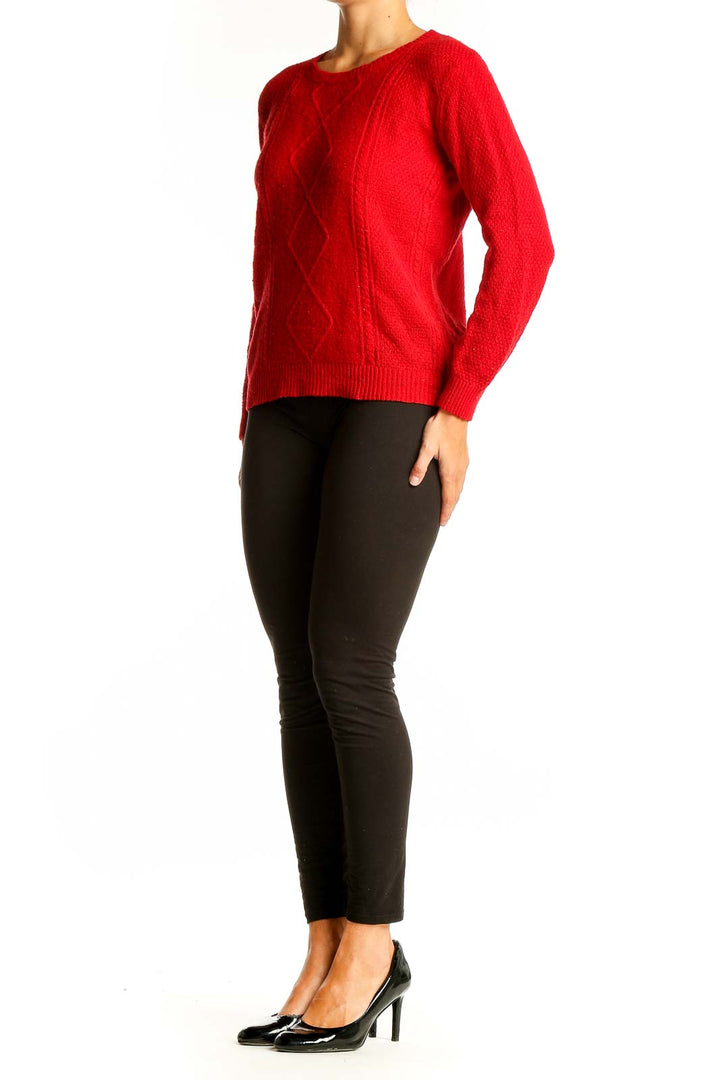 Front view of red cable knit crewneck sweater from Mango