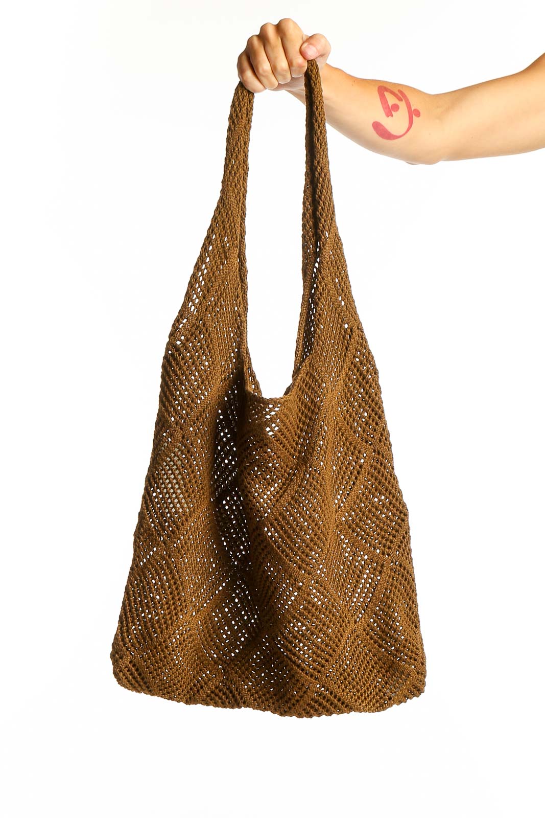 Front view of brown crochet hobo shoulder bag with diamond pattern