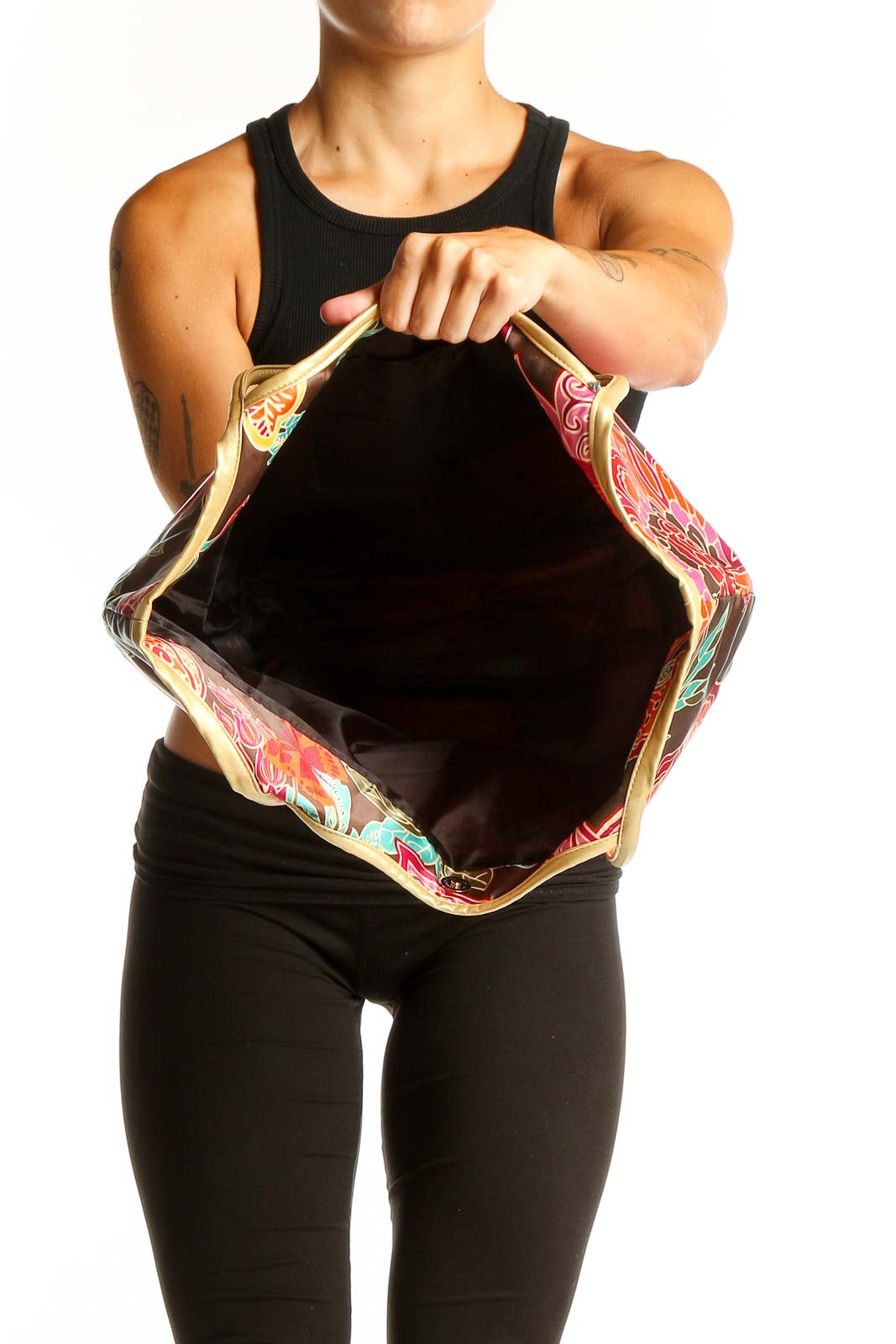 Model holding SilkRoll brown floral print tote bag