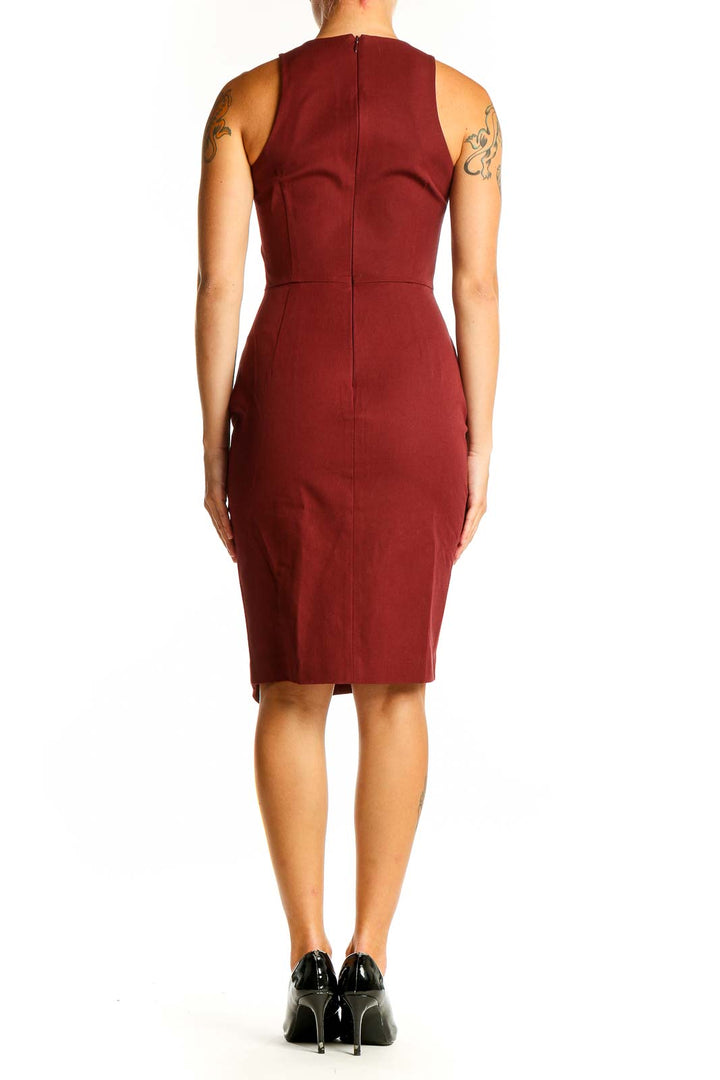 Side view of Banana Republic burgundy sleeveless fitted midi dress showing front slit
