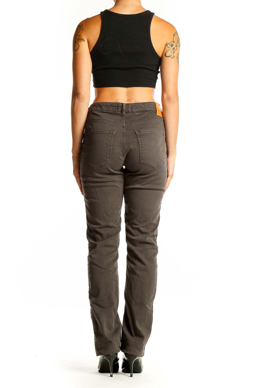 Side view of DU/ER brown straight leg jeans on woman with black top