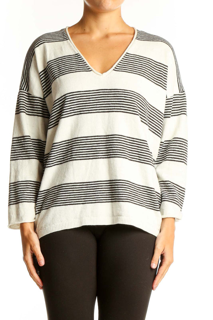 Front view of Madewell white and black striped V-neck sweater