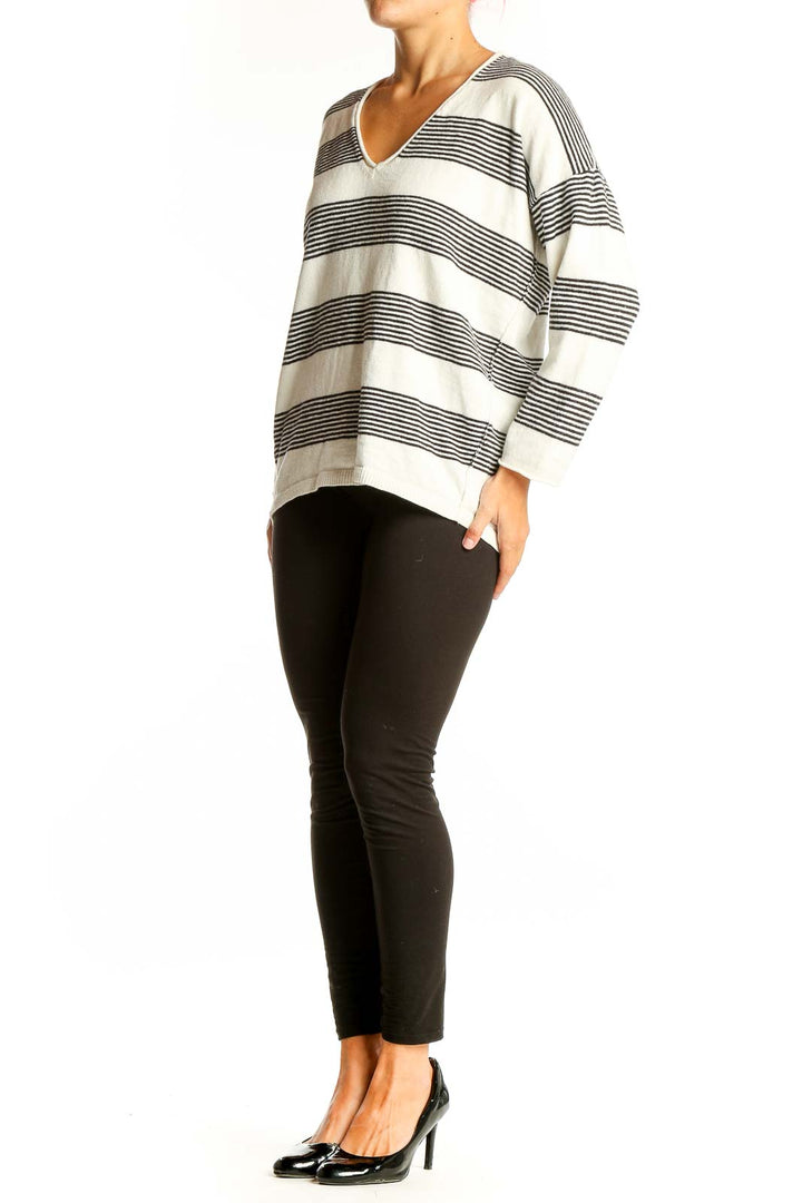 Front view of Madewell white and black striped V-neck sweater