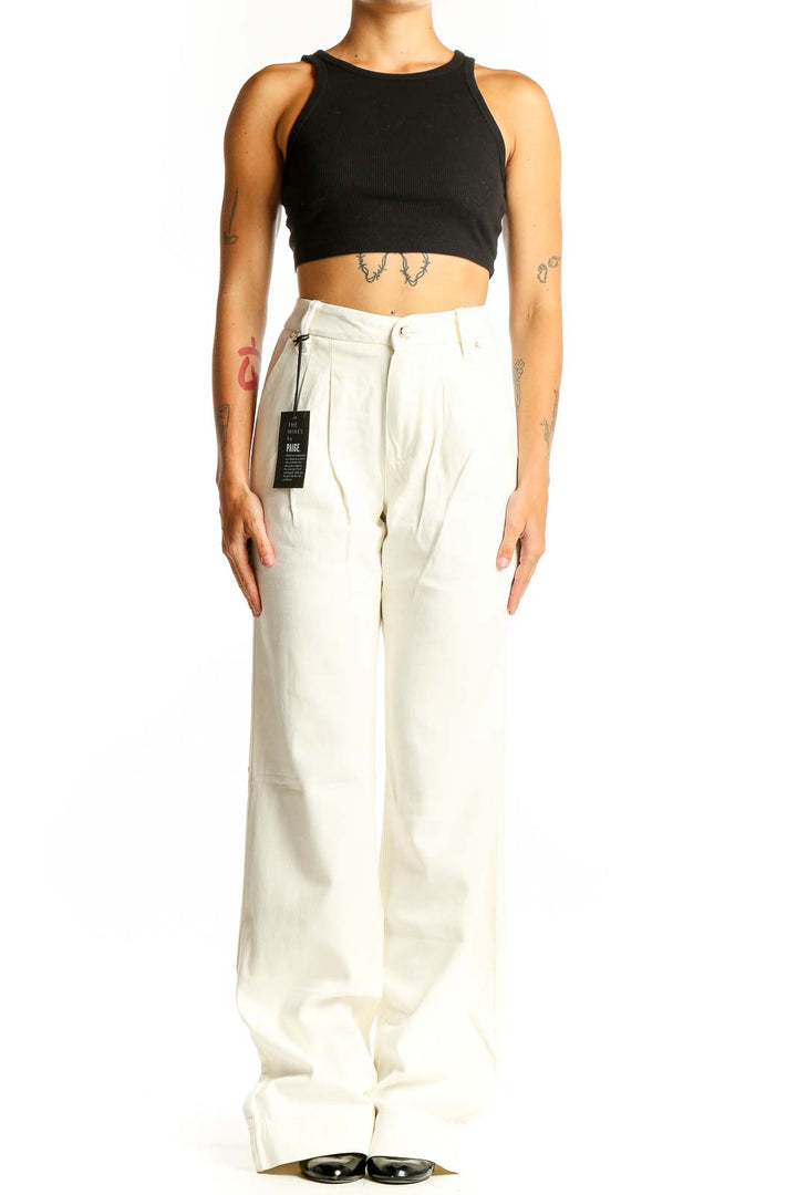 Front view of Paige white wide-leg trousers with pleated design