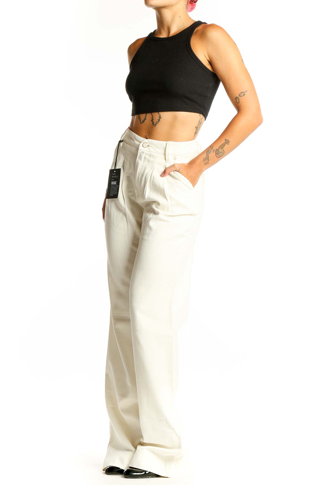 Front view of Paige white wide-leg trousers with pleated design