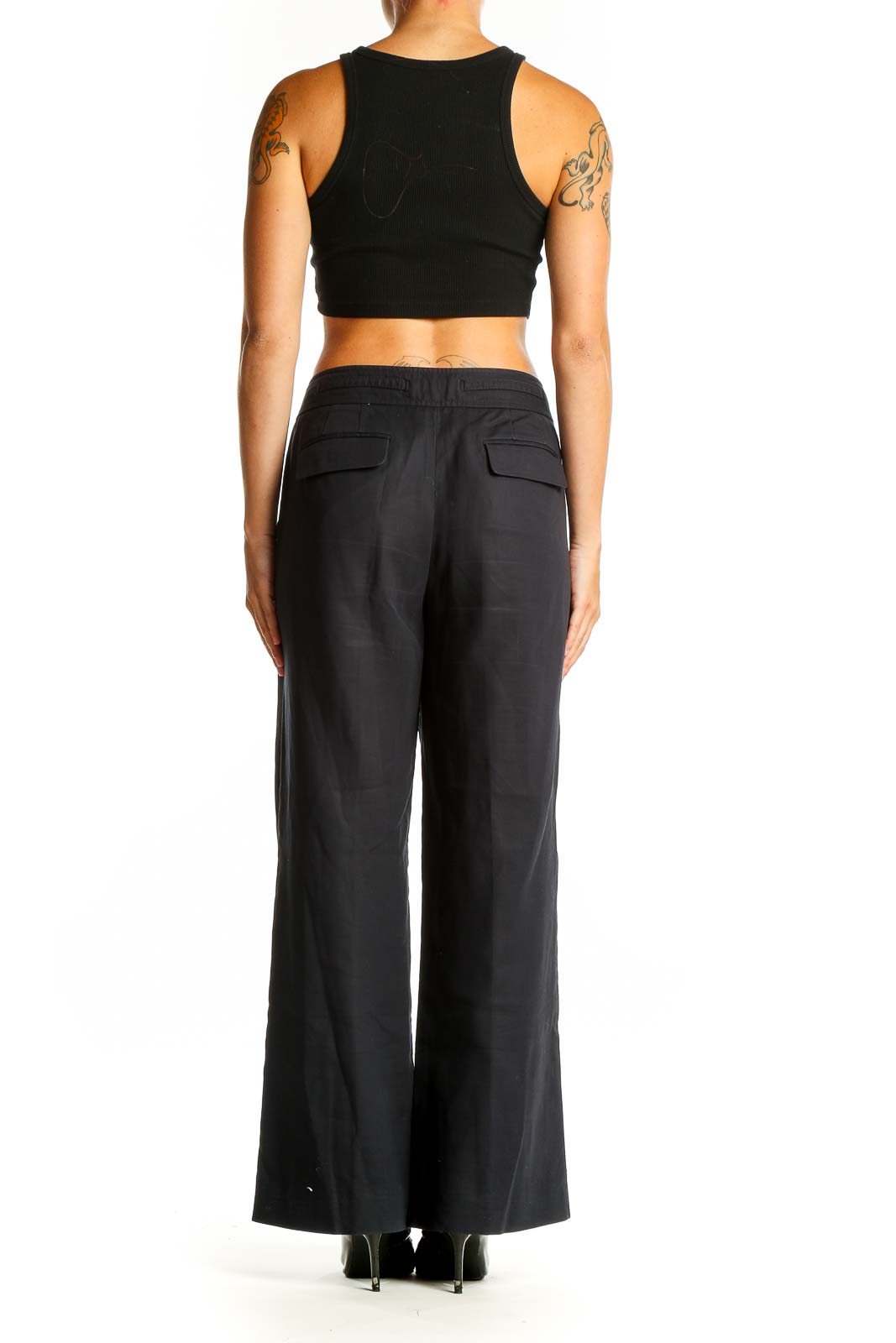 Side view of Ann Taylor black wide-leg acetate pants on model